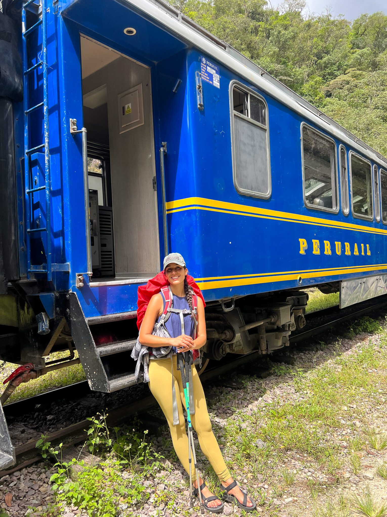 Hidroelectrica Thais sitting on stairs to board train