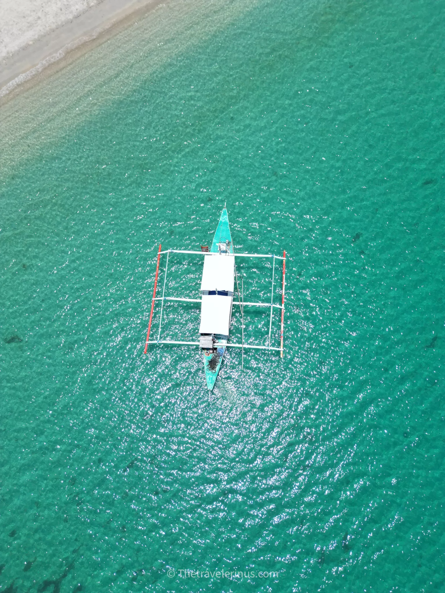 Port Barton, Boat on white sand beach.