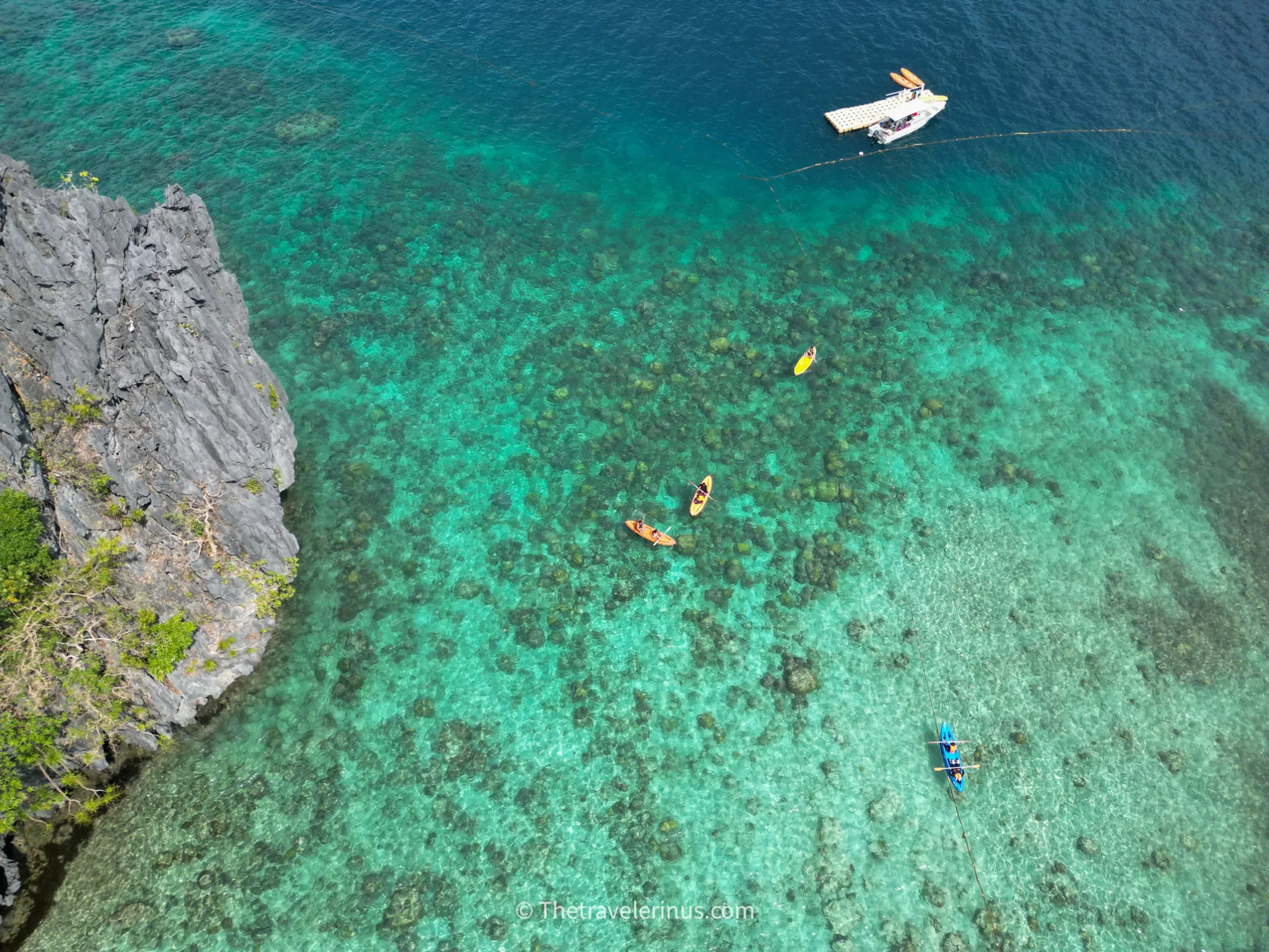 Colorful Ariel view of kayak and landscape in big lagoon in El Nido, Palawan. 