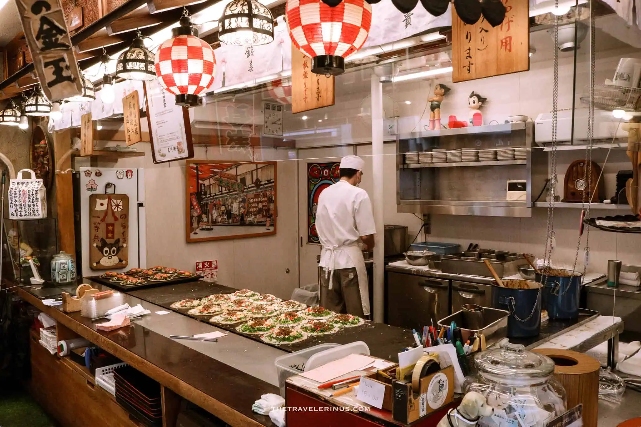 Photo of a cook in an open kitchen in Kyoto