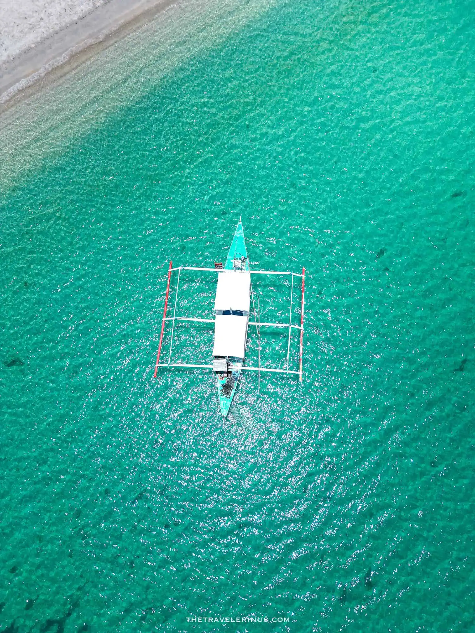 Port Barton, Boat on white sand beach.