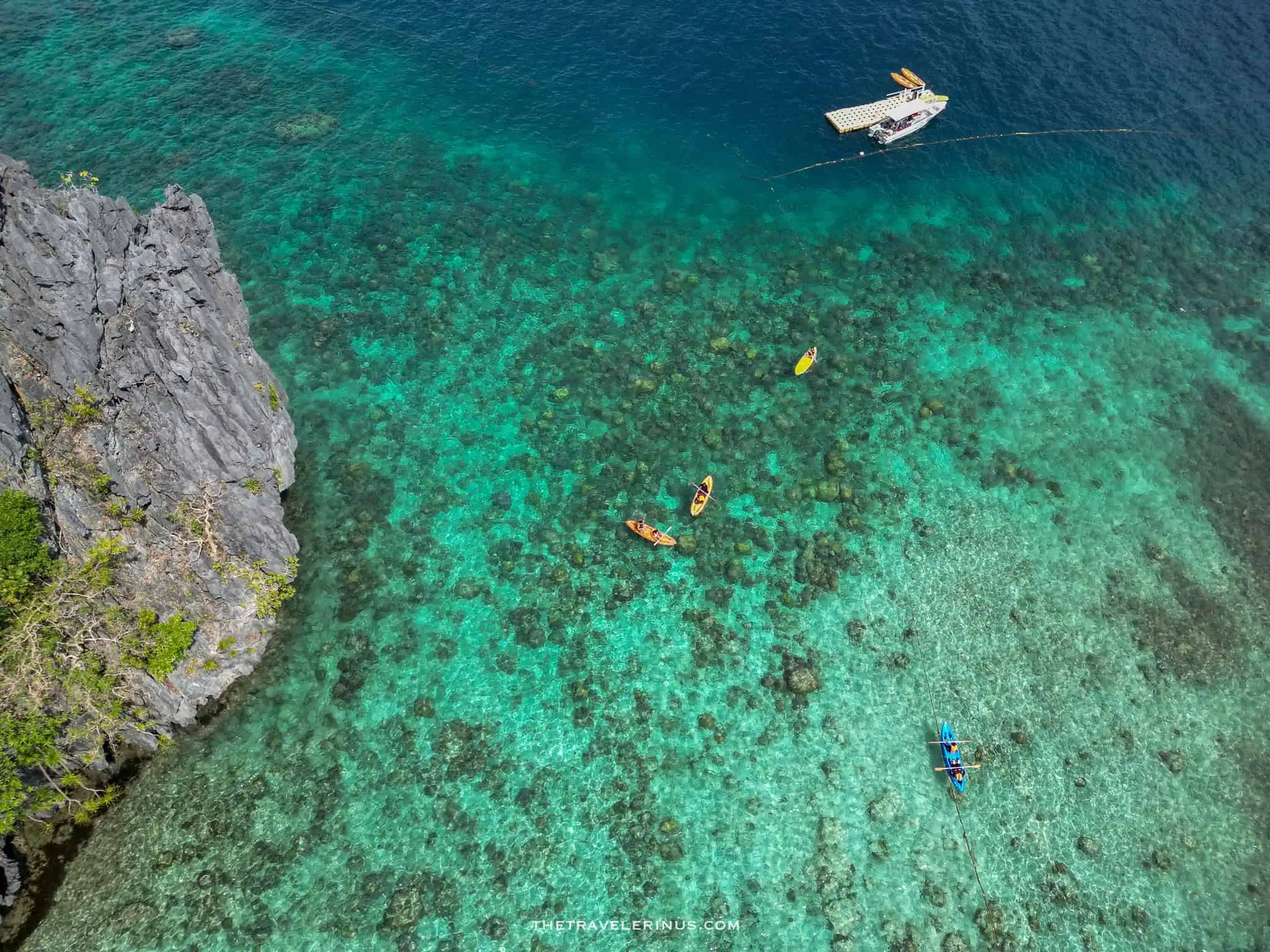 Colorful Ariel view of kayak and landscape in big lagoon in El Nido, Palawan. 