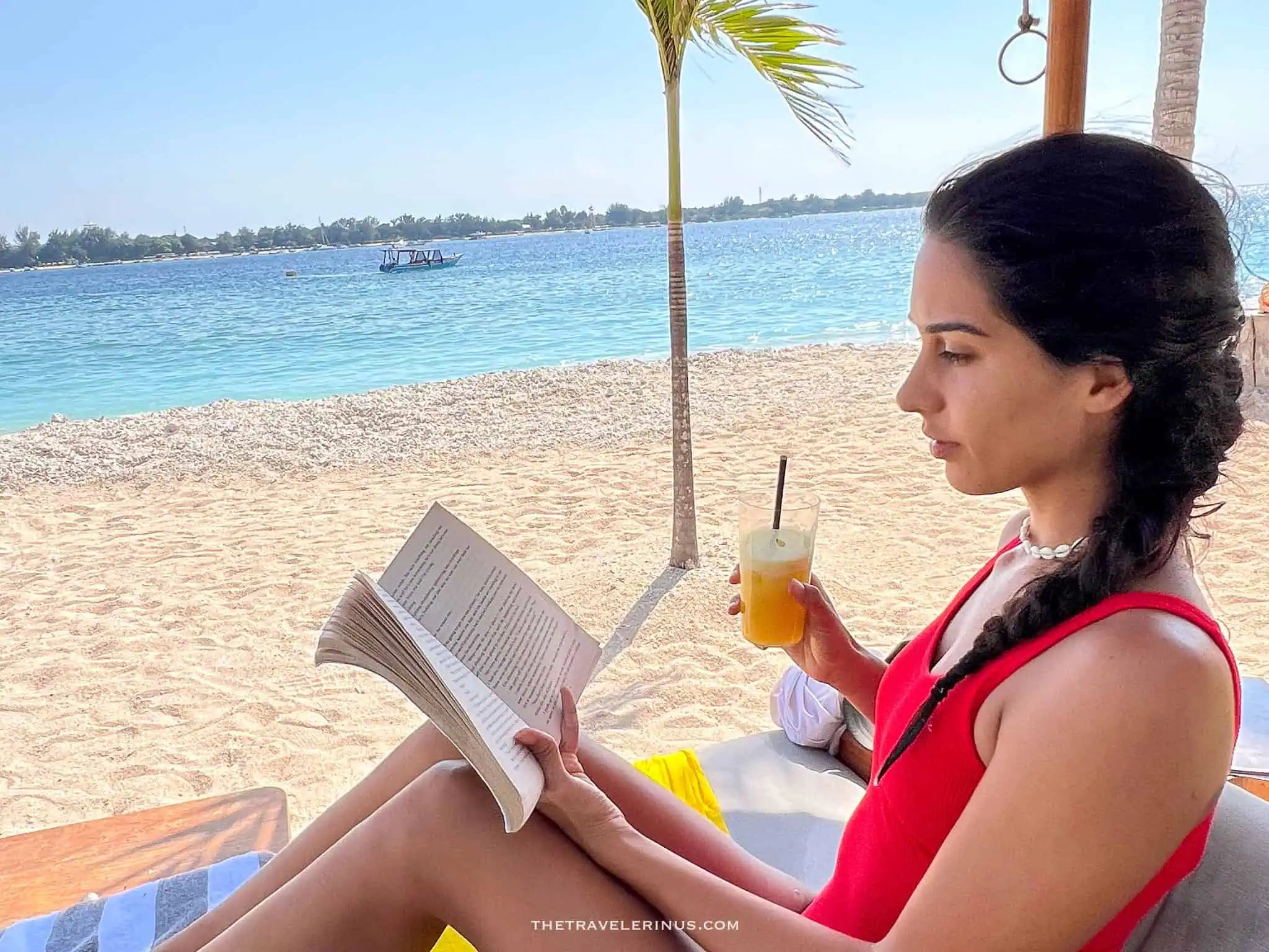 Reading a book by ocean 