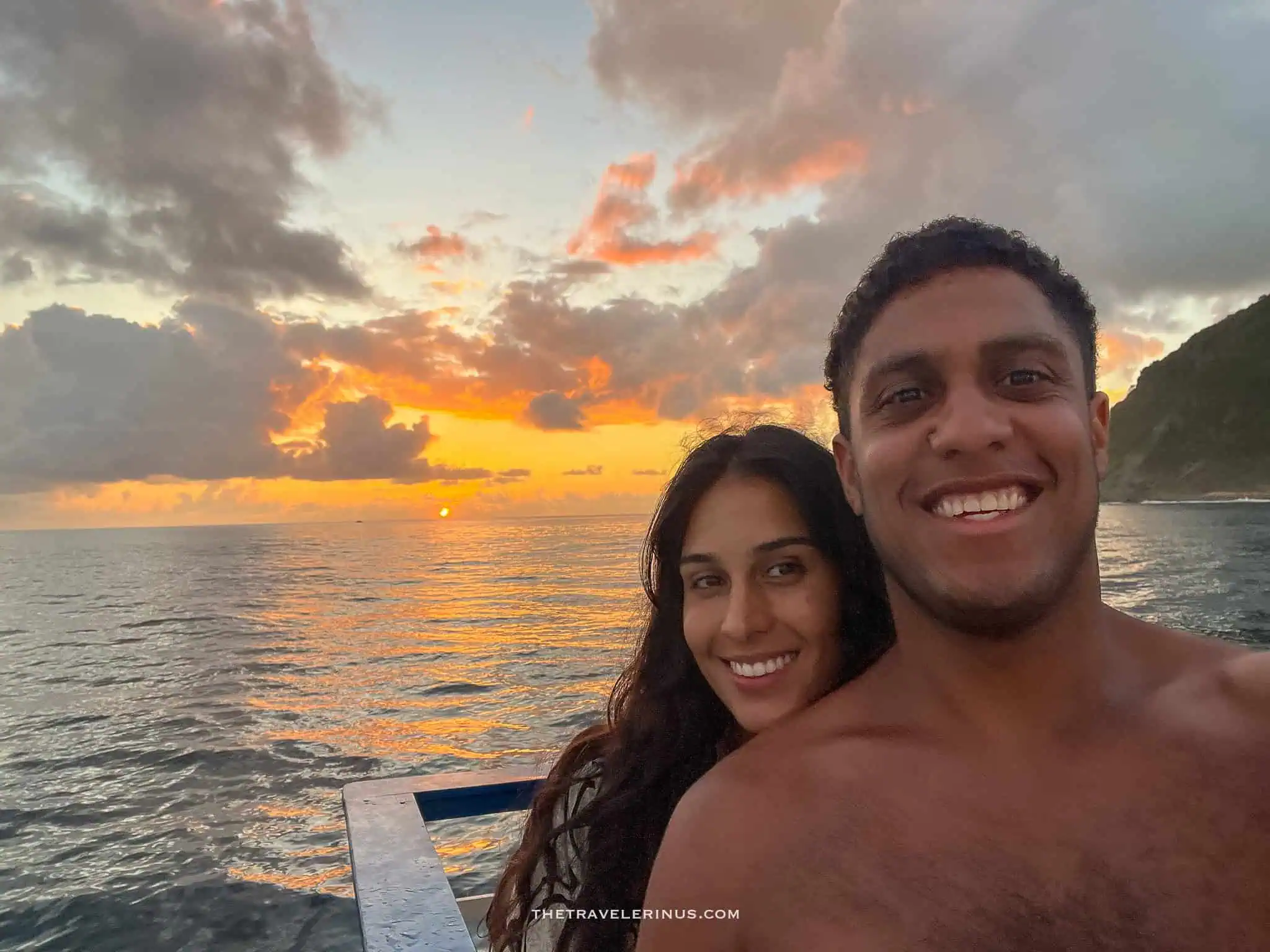 selfie of thais and kelvyn with the sun setting in the background, Fernando de Noronha 
