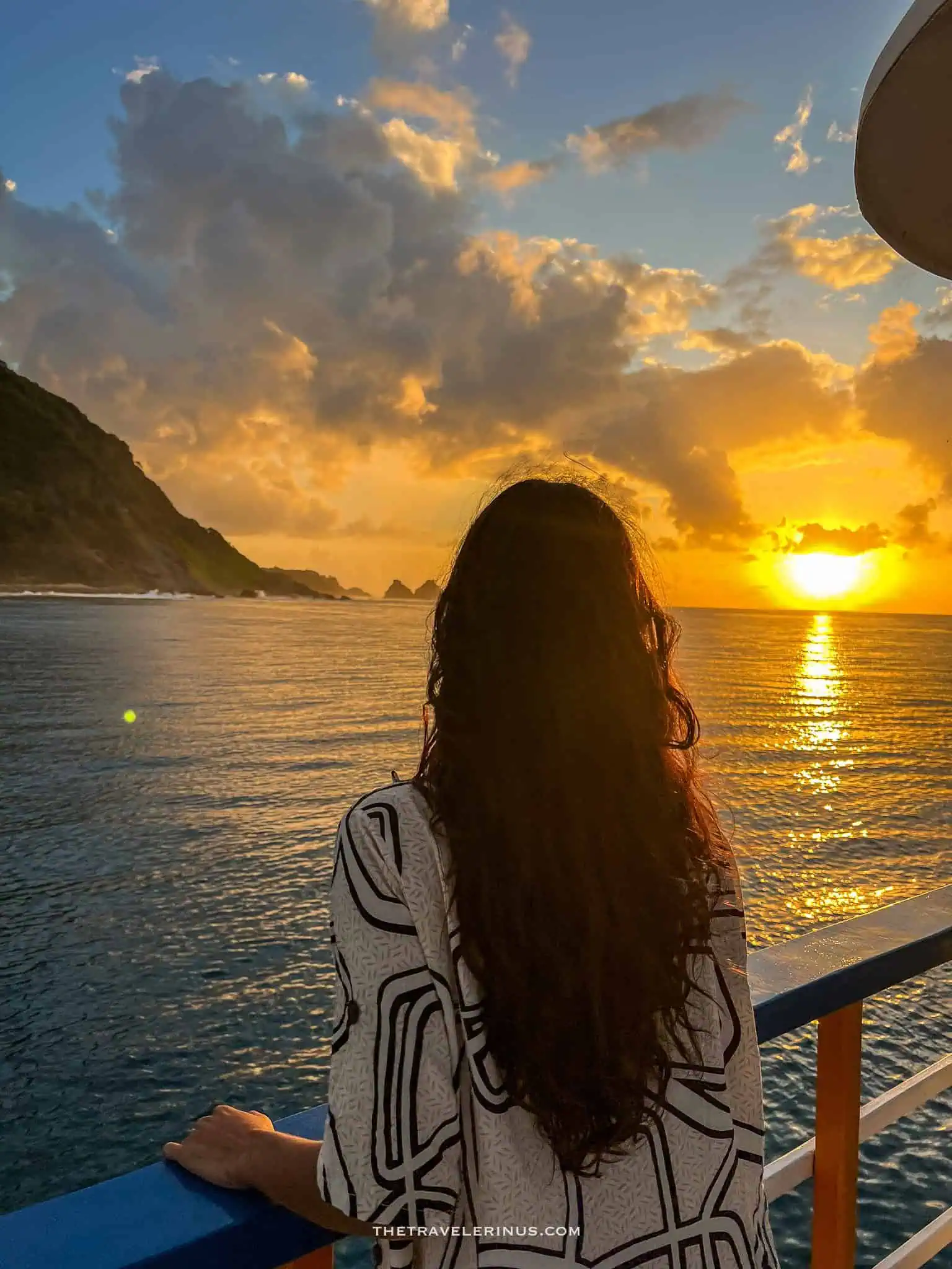 thais looking out into the sunset from the boat, Fernando de Noronha 