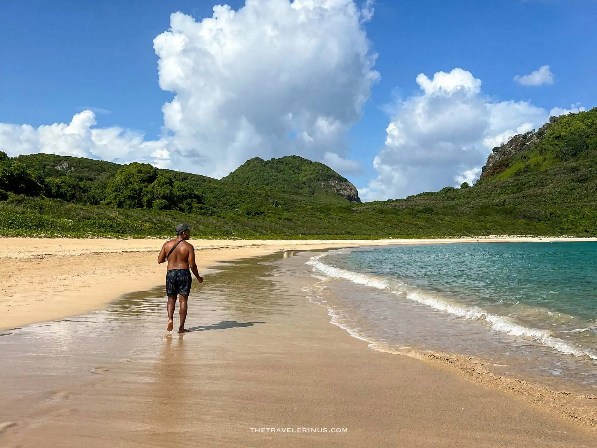 kelvyn walking on the coast of praia do sueste, Fernando de Noronha 