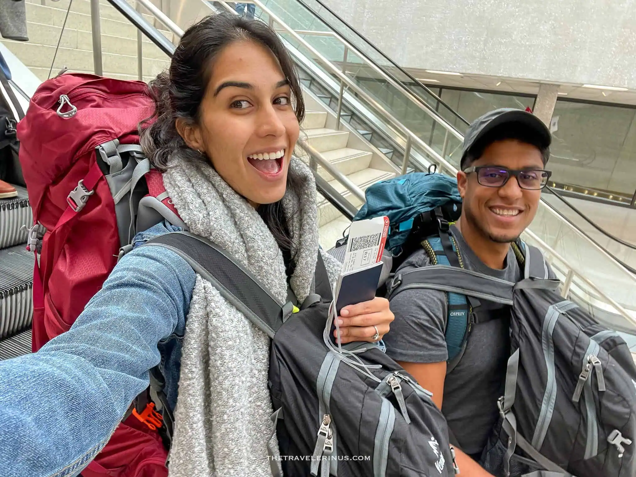 Backpackers: Thais and Kelvyn carrying their backpacks in the airport. Leaving for their firs trip as backpackers in 2022.